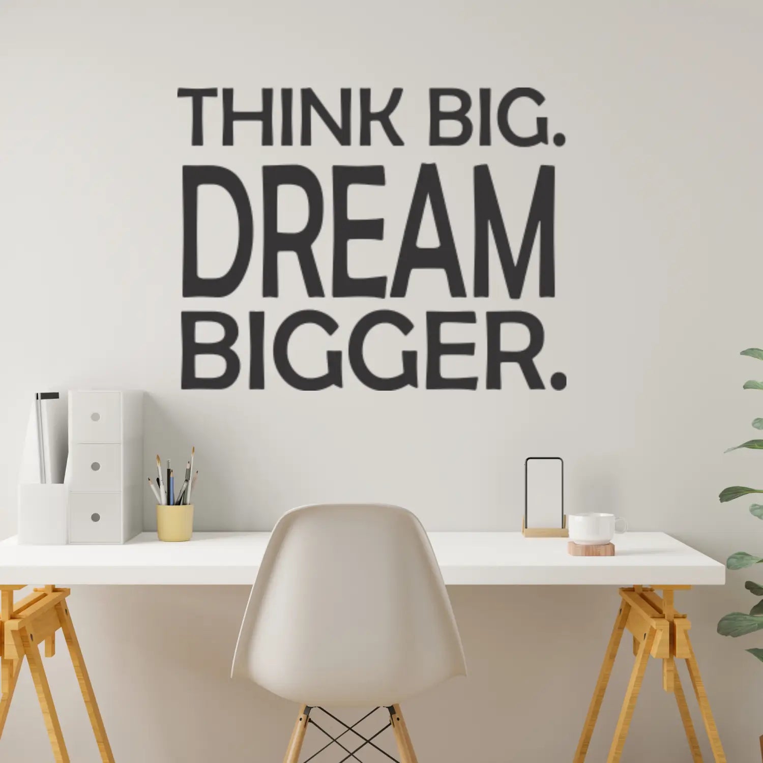 A beautiful vinyl wall display over a home office desk that reads: Think Big. Dream Bigger. A great design decoration for your office, home office, counselor's office, etc.