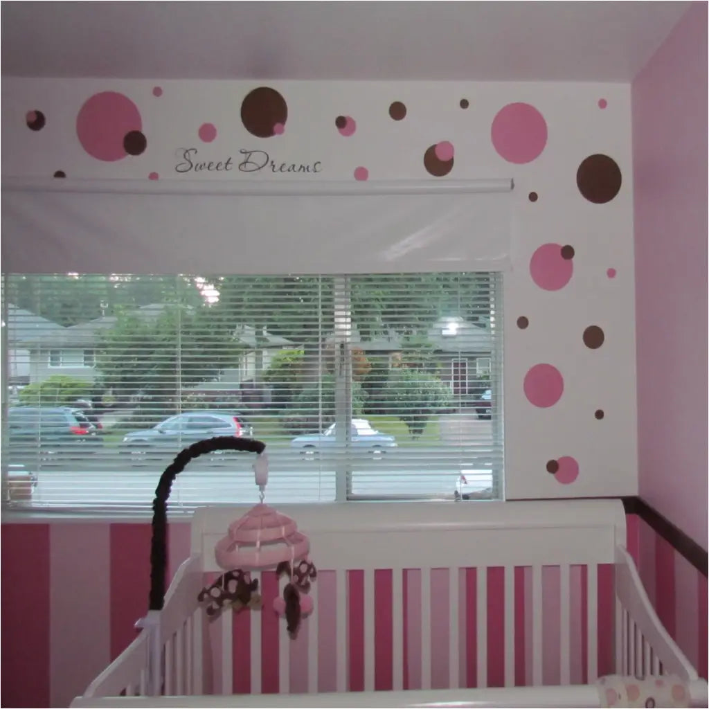 Pink and Brown polka dot themed baby nursery using easy Peel and Stick vinyl wall decals by The Simple Stencil transformed this baby nursery in minutes!