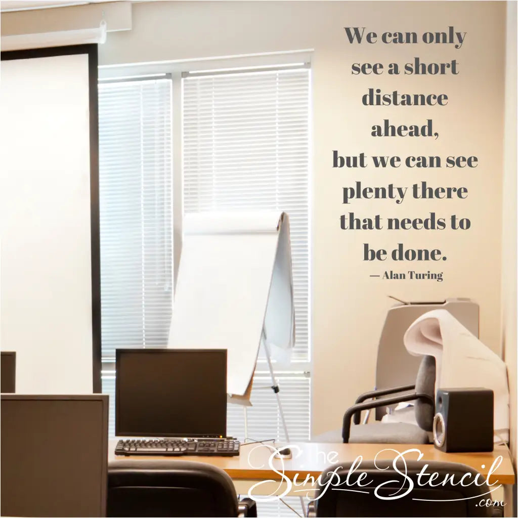 A custom vinyl wall quote decal of the quote by Alan Turing displayed on a wall over an office area and is encouraging and inspirational.