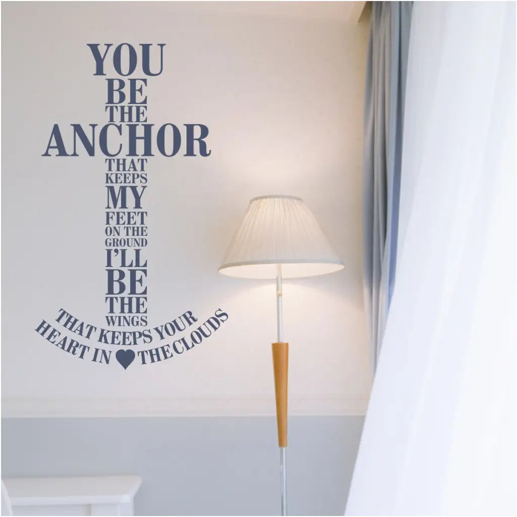 You be the anchor that keeps my feet on the ground. I'll be the wings that keeps your heart in the clouds. A vinyl wall decal display designed in the shape of an anchor to adorn your beach themed rooms by The Simple Stencil