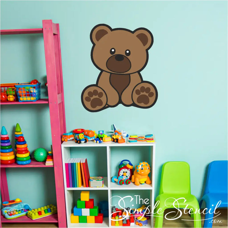 Brown cub bear wall decal applied on a nursery wall with a moon and stars theme.