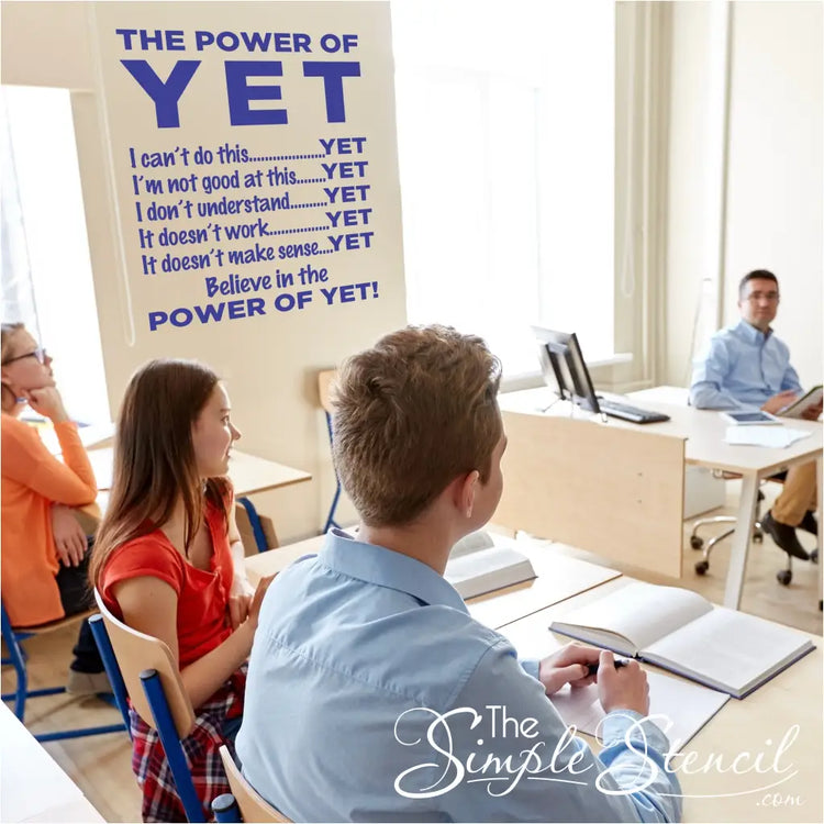A large Believe in the Power of Yet decal displayed on a highschool classroom wall.