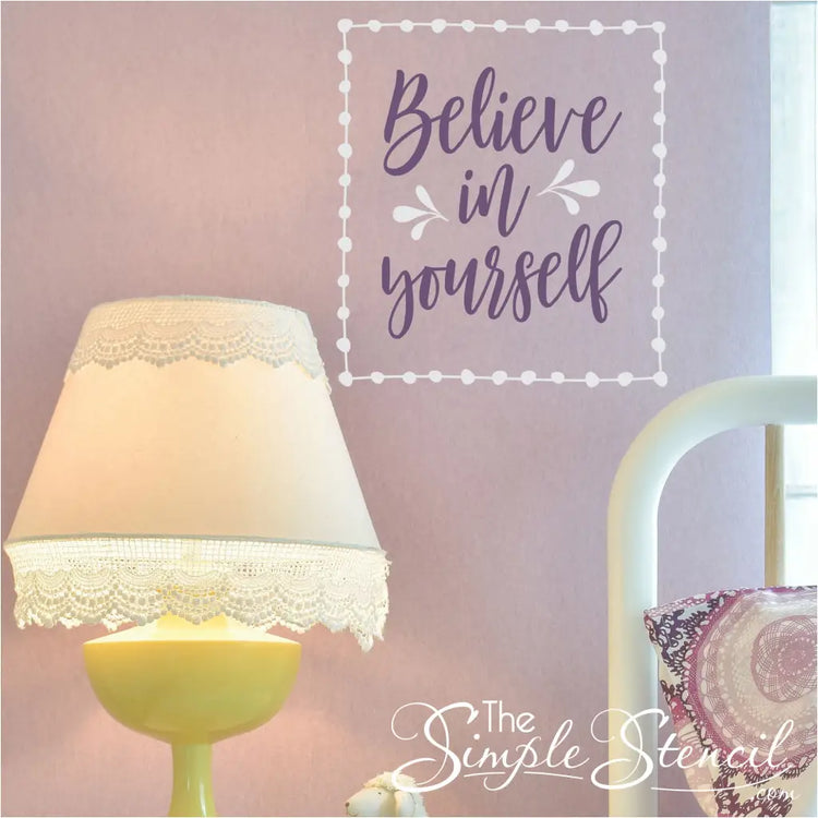 Believe in Yourself vinyl wall decal in white and purple on a pink wall. A great Simple Stencil design for a girls room with it's whimsical pattern.