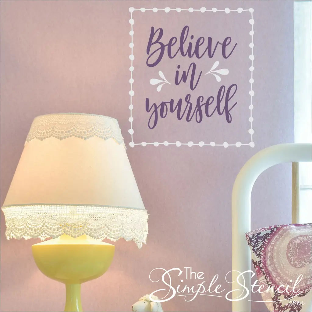 Believe in Yourself vinyl wall decal in white and purple on a pink wall. A great Simple Stencil design for a girls room with it's whimsical pattern.