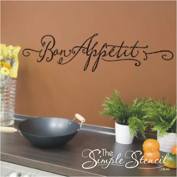 Bon Appetit vinyl wall decal by The Simple Stencil shown on a kitchen wall backsplash.