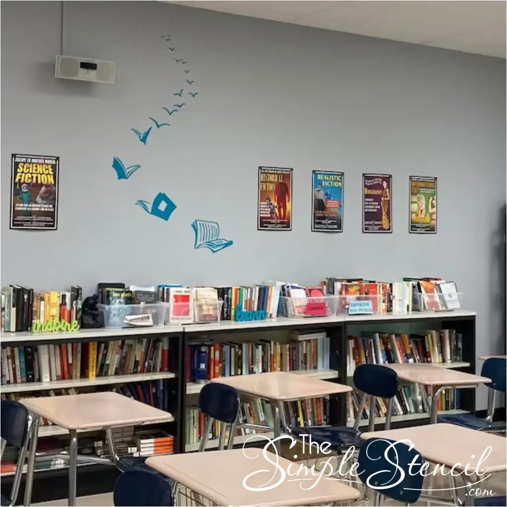 A picture from a customer showing the creative way she installed our Books Have Wings decal in a pattern to fit her space. Fun flying book design on school classroom wall to inspire students and designate a reading area. 