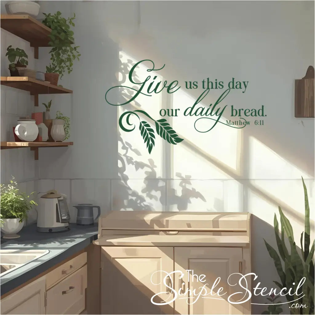 A sunny kitchen adorned with a green "Give us this day our daily bread. Matthew 6:11" wall decal. The scripture quote is placed above a light-colored cabinet, complementing the various potted plants and natural light streaming into the cozy kitchen, perfect for inspiring daily gratitude and faith-based home decor.
