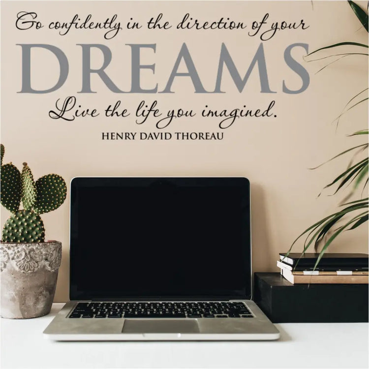 Henry David Thoreau wall quote decal applied to a study area work desk that reads: Go confidently in the direction of your dreams, live the life you imagined.
