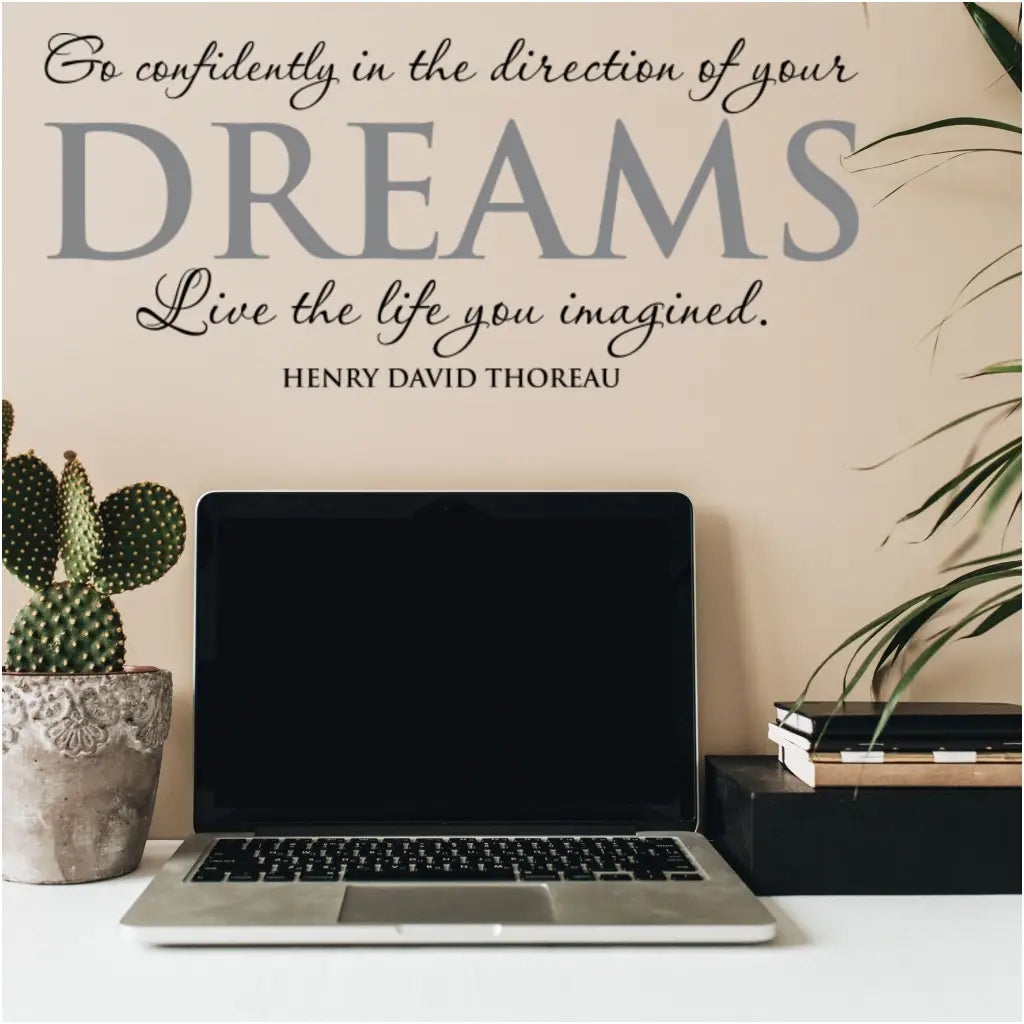 Henry David Thoreau wall quote decal applied to a study area work desk that reads: Go confidently in the direction of your dreams, live the life you imagined. 