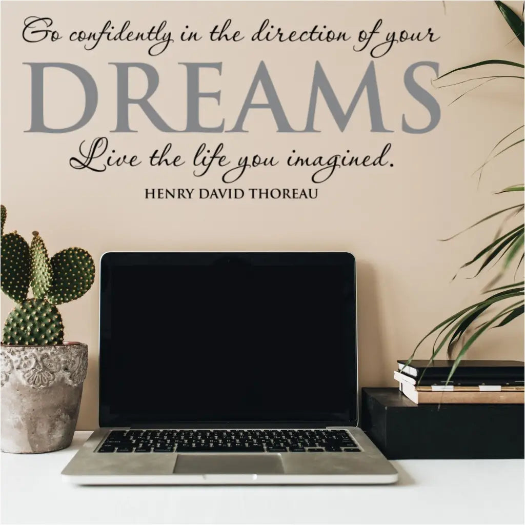 Henry David Thoreau wall quote decal applied to a study area work desk that reads: Go confidently in the direction of your dreams, live the life you imagined.