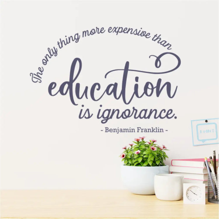 Wall decal with Benjamin Franklin quote in a teacher's lounge, providing daily inspiration.