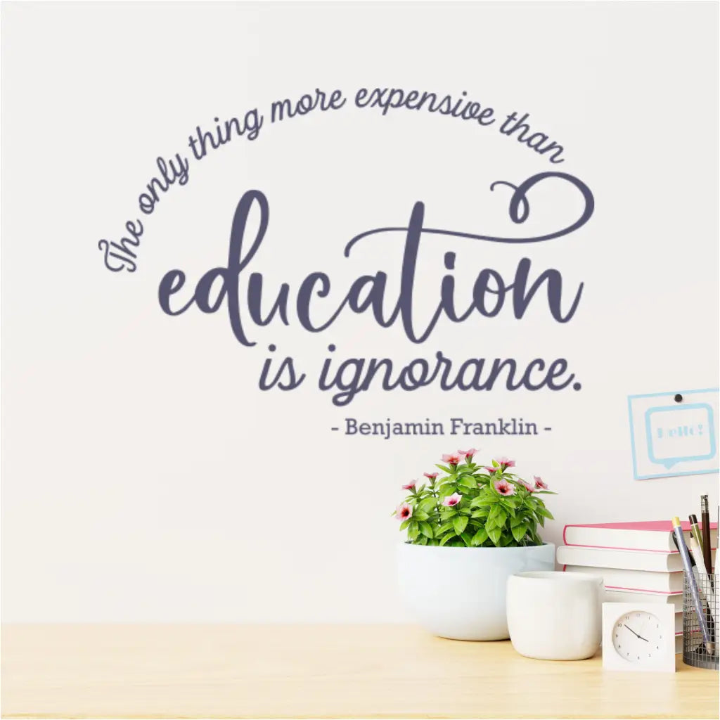 Wall decal with Benjamin Franklin quote in a teacher's lounge, providing daily inspiration.