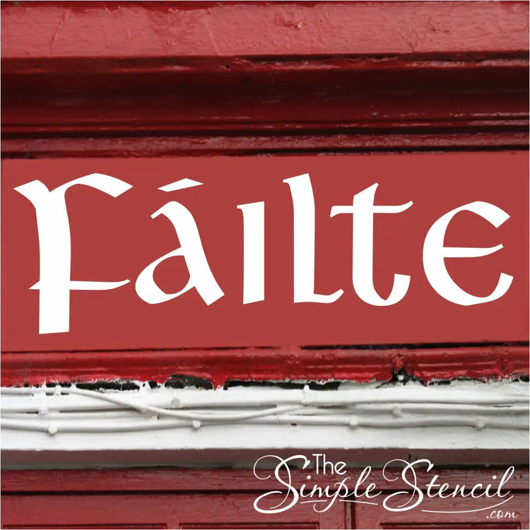 A photorealistic image of a traditional Irish pub entrance. The "Fáilte" wall decal is displayed prominently above the pub door, written in a white vinyl on a red wall for maximum impact.