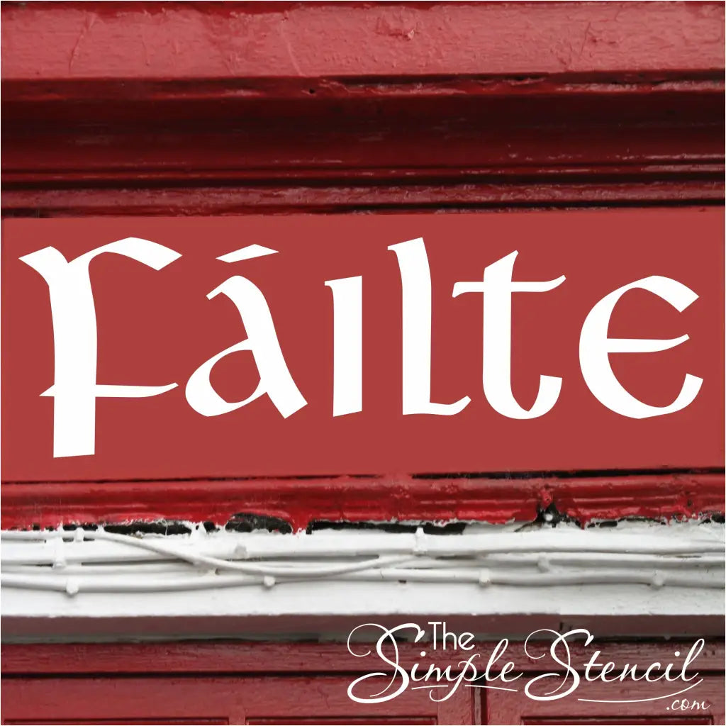A photorealistic image of a traditional Irish pub entrance. The "Fáilte" wall decal is displayed prominently above the pub door, written in a white vinyl on a red wall for maximum impact.