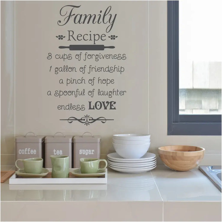 Family Recipe wall decal perfect for kitchen decorating. Reads: Family Recipe, 3 cups of forgiveness, 1 gallon of friendship, a pinch of hope, a spoonful of laughter endless love.  The Simple Stencil