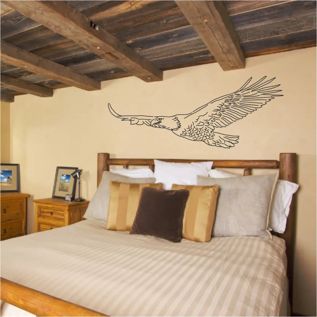 Flying eagle wall decal art by The Simple Stencil adds a rustic look to this farmhouse guestroom.