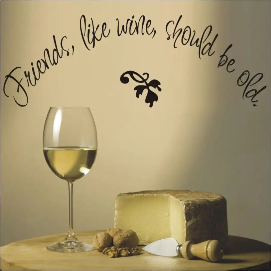 Friends Like Wine Should Be Old. - A pretty wall decal in black installed on a wall near a wine rack makes a nice gift for a friend who is also a wine enthusiast.