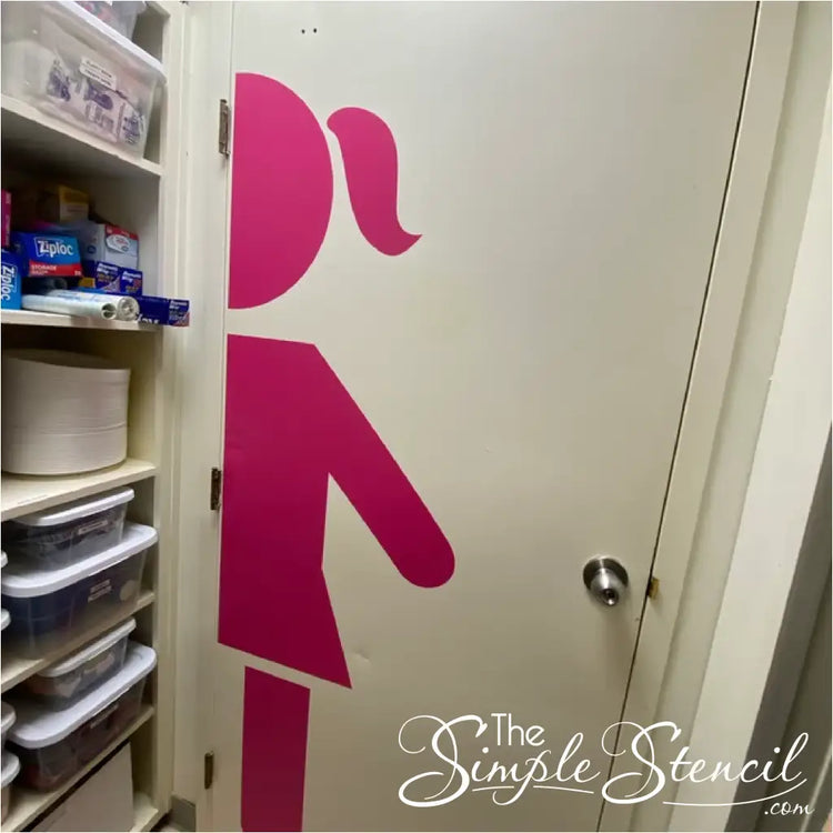 Girl Restroom Sign Decal installed on a door in workspace to designate womens or girls restroom - design and decal supplied by The Simple Stencil