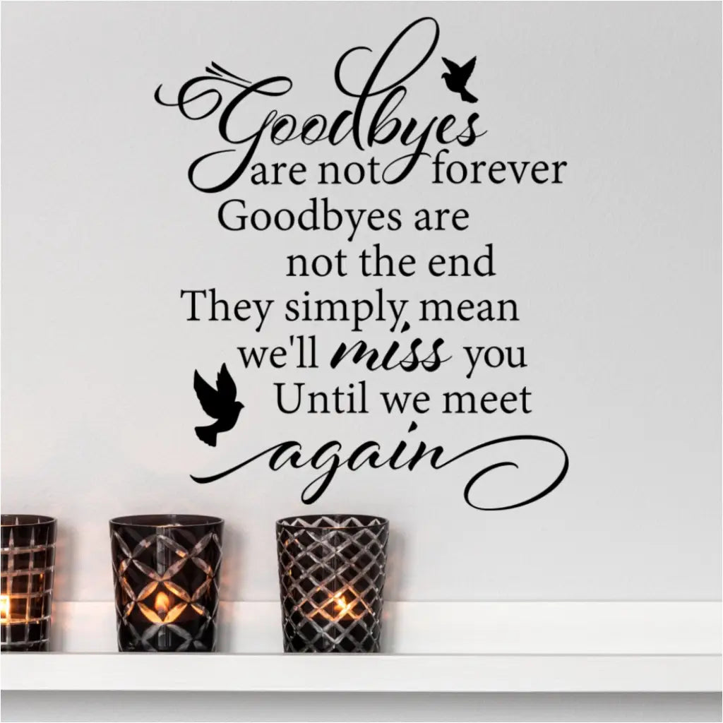 Goodbyes Are Not Forever | Memorial Picture Wall Quote Decal | Shown applied to a wall over a set of lit candles and looks beautiful in a place it can be looked upon often to remind of our lost loved ones in a positive way.