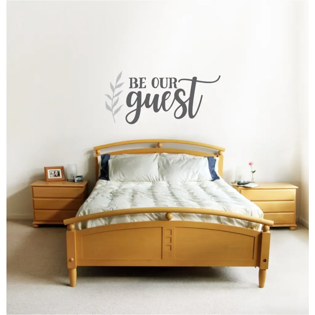 Beautiful "be our guest" wall decal over guest bedroom suite with coordinating leaf flourish by The Simple Stencil. Wall art and decals for your home decor. 