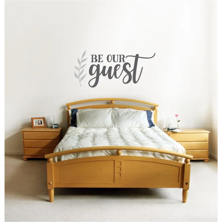 Beautiful "be our guest" wall decal over guest bedroom suite with coordinating leaf flourish by The Simple Stencil. Wall art and decals for your home decor. 