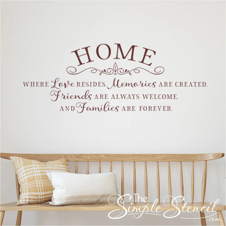 Home Where Love Resides Wall Decal in Brown Vinyl on White Wall with Wooden Bench and Pillows