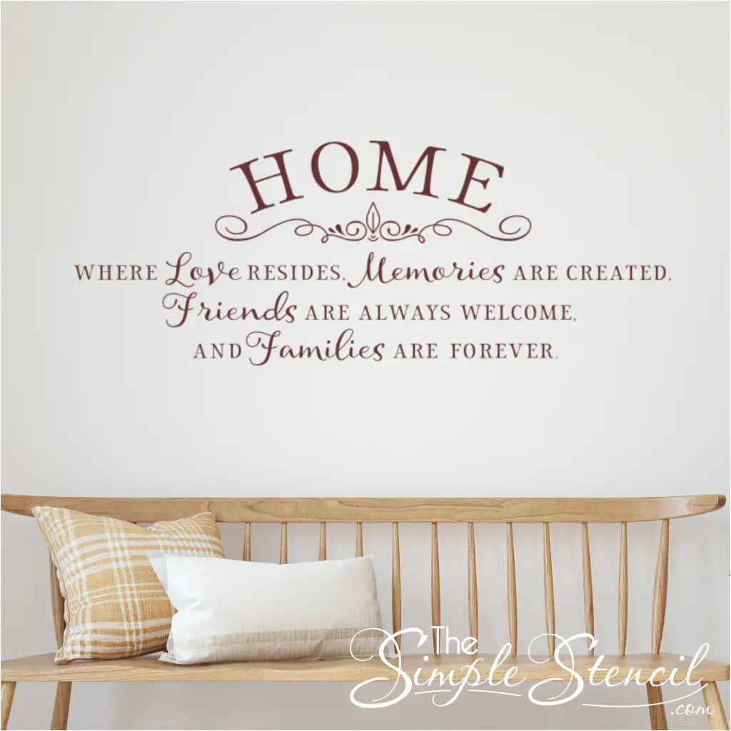 Home Where Love Resides Wall Decal in Brown Vinyl on White Wall with Wooden Bench and Pillows
