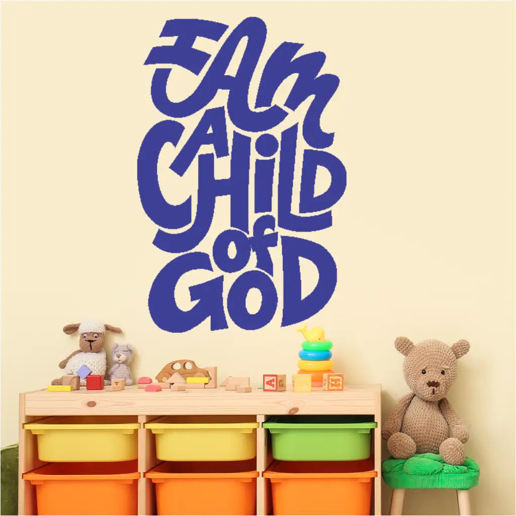 Large blue vinyl decal with colorful text reading "I Am A Child of God" displayed on a light yellow church nursery wall.