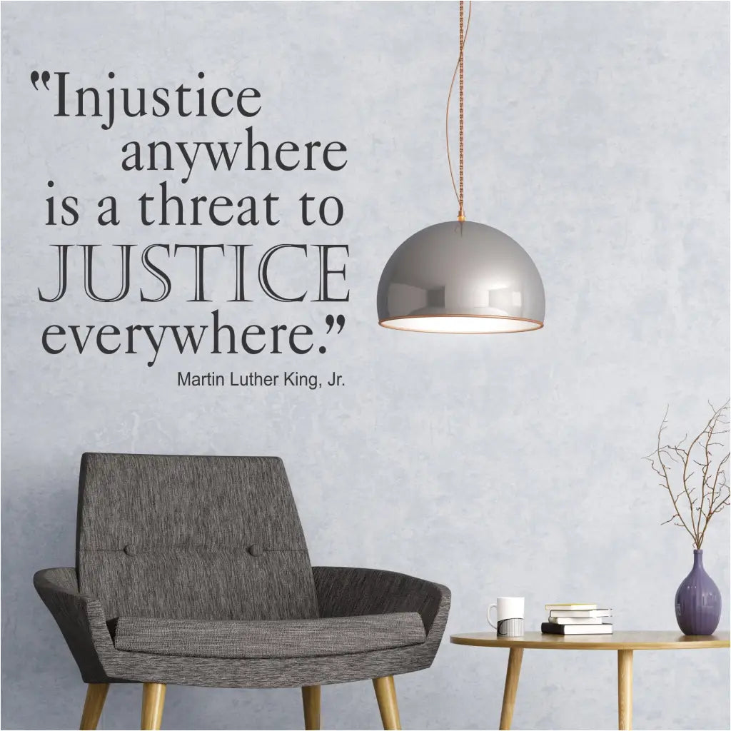 Injustice Anywhere Quote By Martin Luther King Jr. displayed on a lobby wall in black. Full wall quote by The Simple Stencil reads: Injustice anywhere is a threat to justice everywhere. Martin Luther King, Jr.