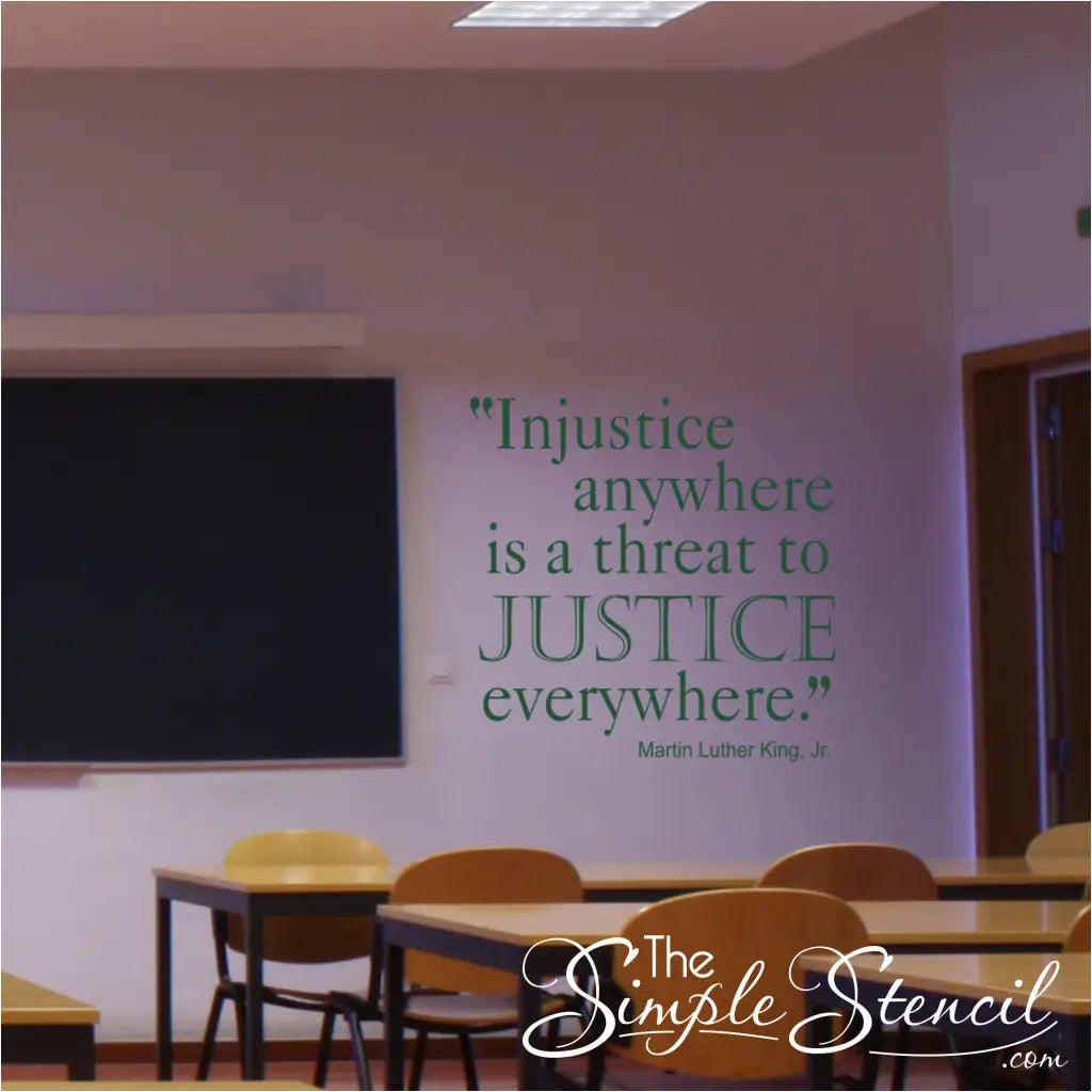 An American History school classroom with a large dark green wall display by Martin Luther King Jr. that reads: Injustice anywhere is a threat to justice everywhere.