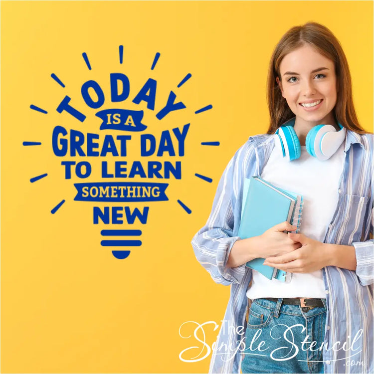 Vinyl wall sticker with a lightbulb illustration and the uplifting phrase about learning something new each day.