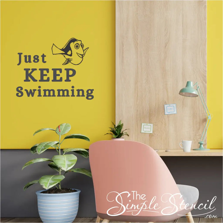 "Just Keep Swimming" wall decal applied on a yellow office wall to motivate and inspire yourself or employees.