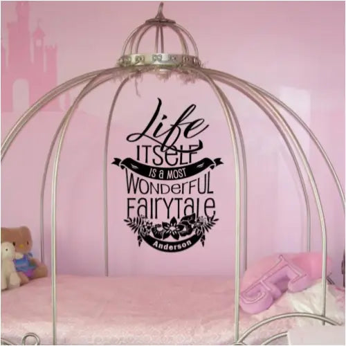 vinyl wall quote decal in a pink fairytale themed bedroom reads: Life itself is a most wonderful fairytale ~Anderson