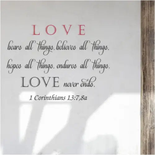 Love bears all things, believes all things, hopes all things, endures all things. Love never ends. Bible verse wall decal art by The Simple Stencil