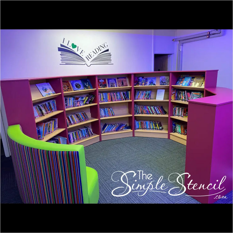 Customer submitted picture of this I Love Reading wall decal displayed in a larger size on a library wall - Submitted by Church of England Primary School using TheSimpleStencil.com  library wall art.