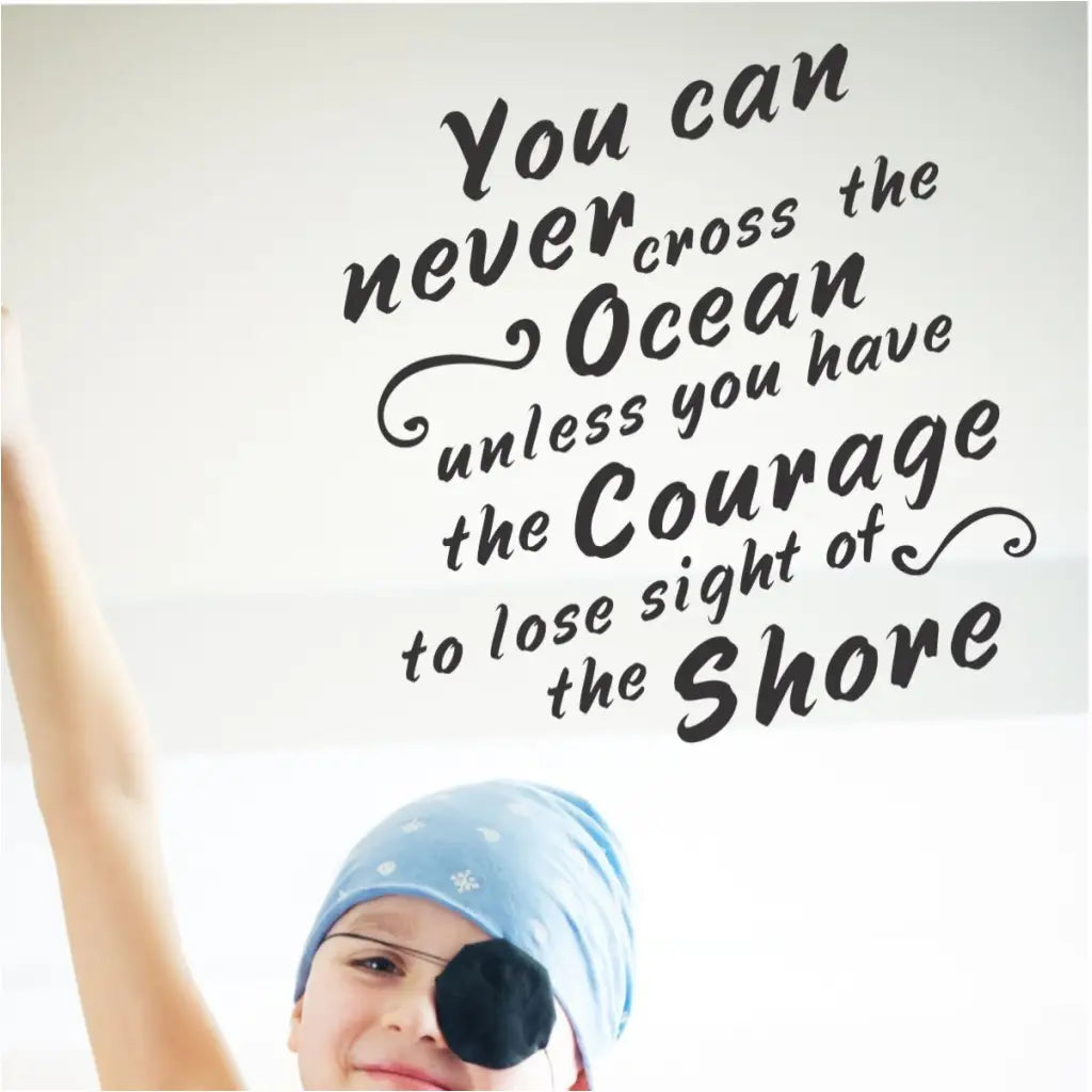 An inspiring wall quote decal by The Simple Stencil reads: You can never cross the ocean unless you have the courage to lose sight of shore.