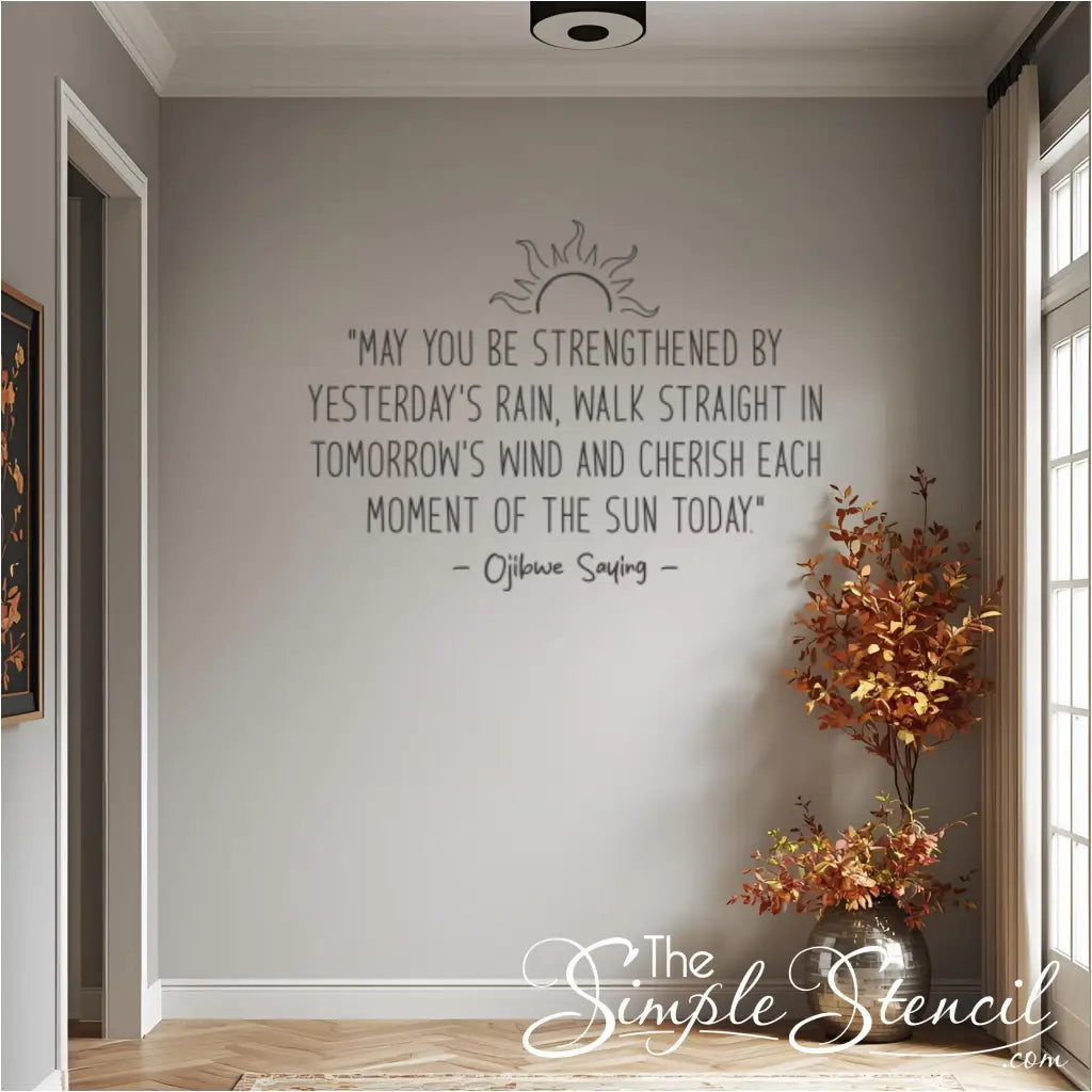 The Ojibwe proverb wall decal in gray, shown in a home entryway next to a vase with orange autumn leaves, connecting it to fall decor.