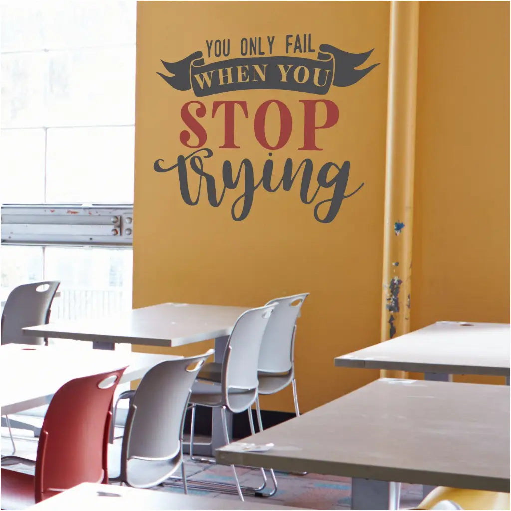 You only fail when you stop trying. A large wall quote decal by The Simple Stencil displayed on a classroom wall to inspire students. 