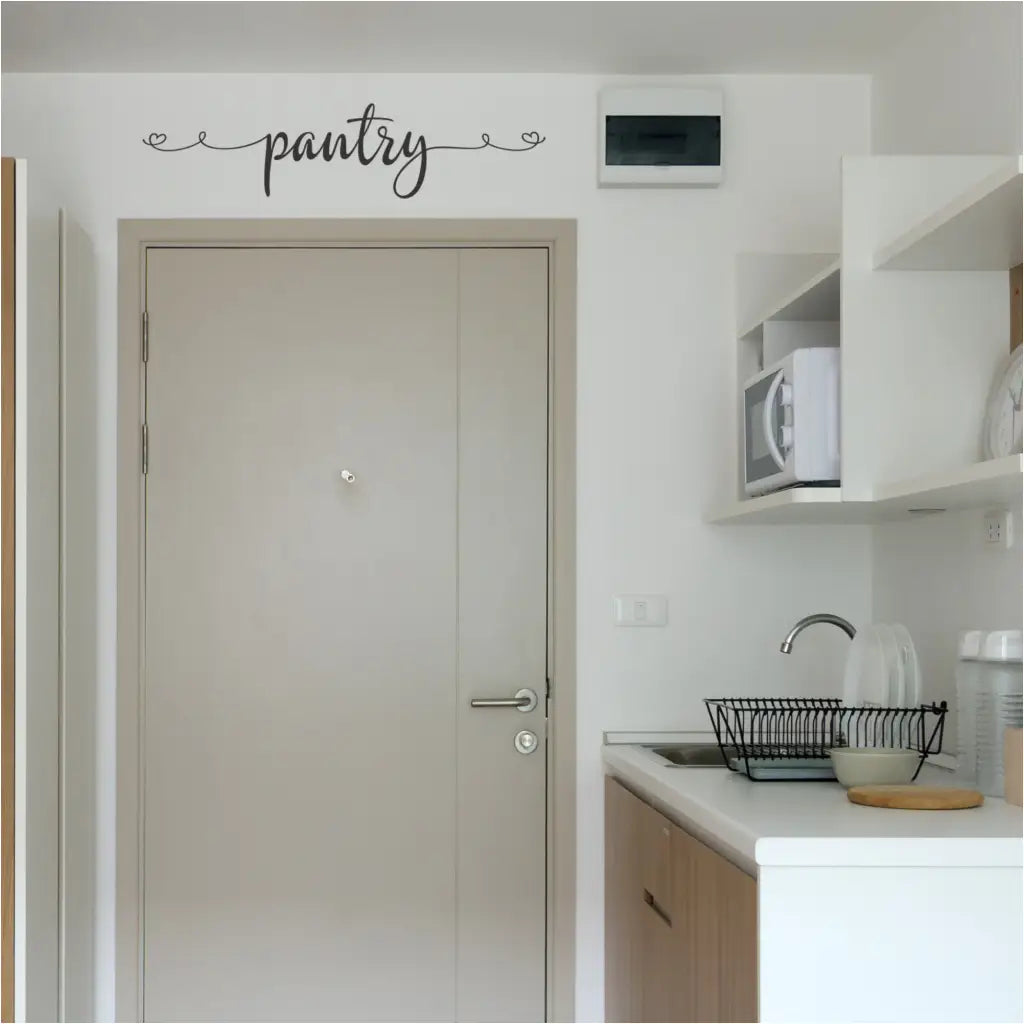 Pretty Farmhouse Inspired Pantry Door or Wall Decal placed over the pantry door in a simple kitchen by The Simple Stencil
