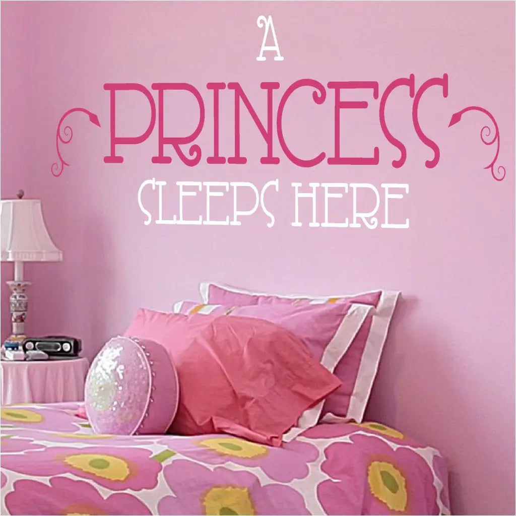 A princess sleeps here vinyl wall decal with flourishes applied over a little girl's bed to help them feel like the princess they are!