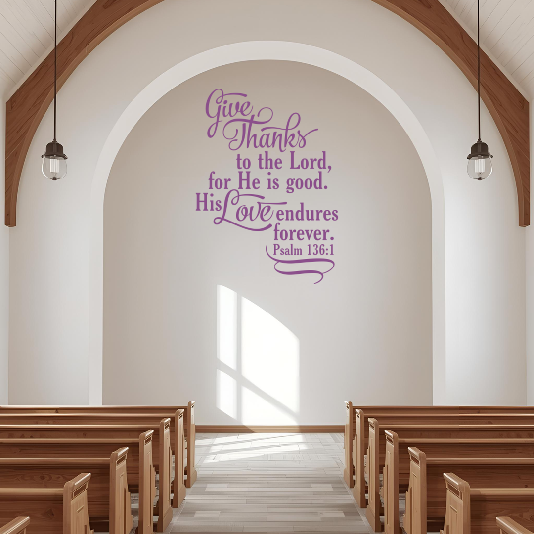 Large Psalm 136:1 religious wall stencil in light purple, applied to a white archway above pews in a bright, modern church sanctuary.