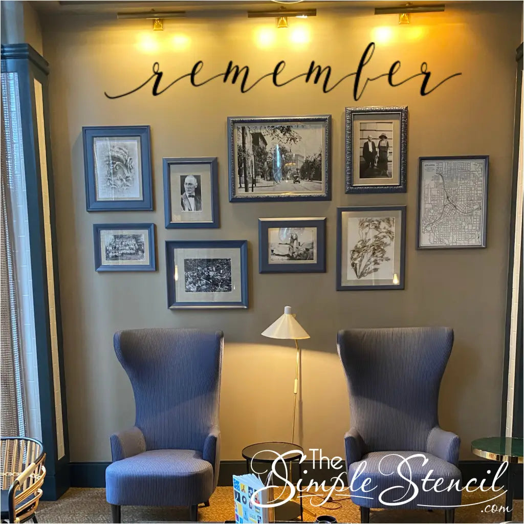 a beautiful family picture wall over a sitting area with the wall decal that reads simply remember to highlight their ancestors memories.