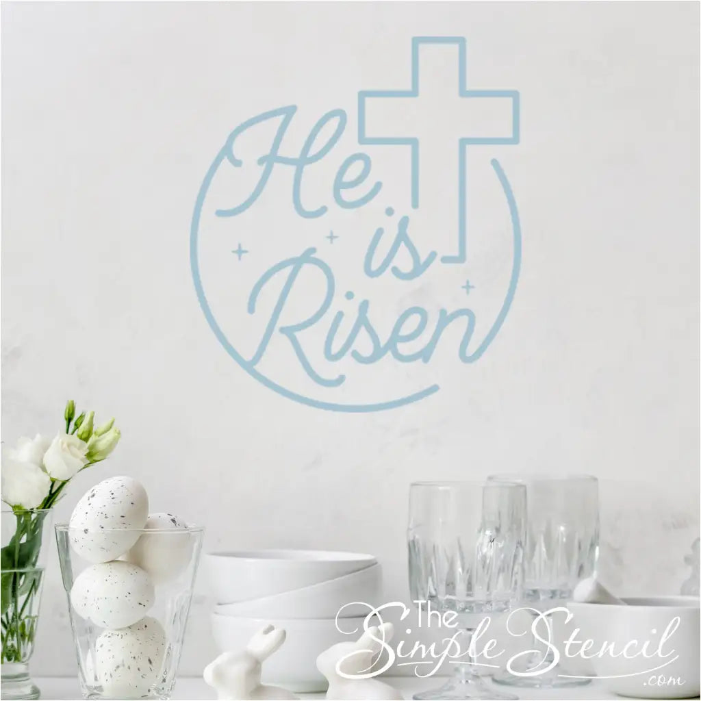 The "He is risen" wall decal with the cross graphic, promoting the message of Easter.