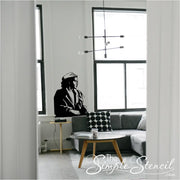 Rosa Parks Silhouette Wall Decal Sticker featuring Rosa Parks seated on bus as if she is looking out the window.