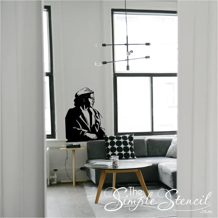 Rosa Parks Silhouette Wall Decal Sticker featuring Rosa Parks seated on bus as if she is looking out the window.