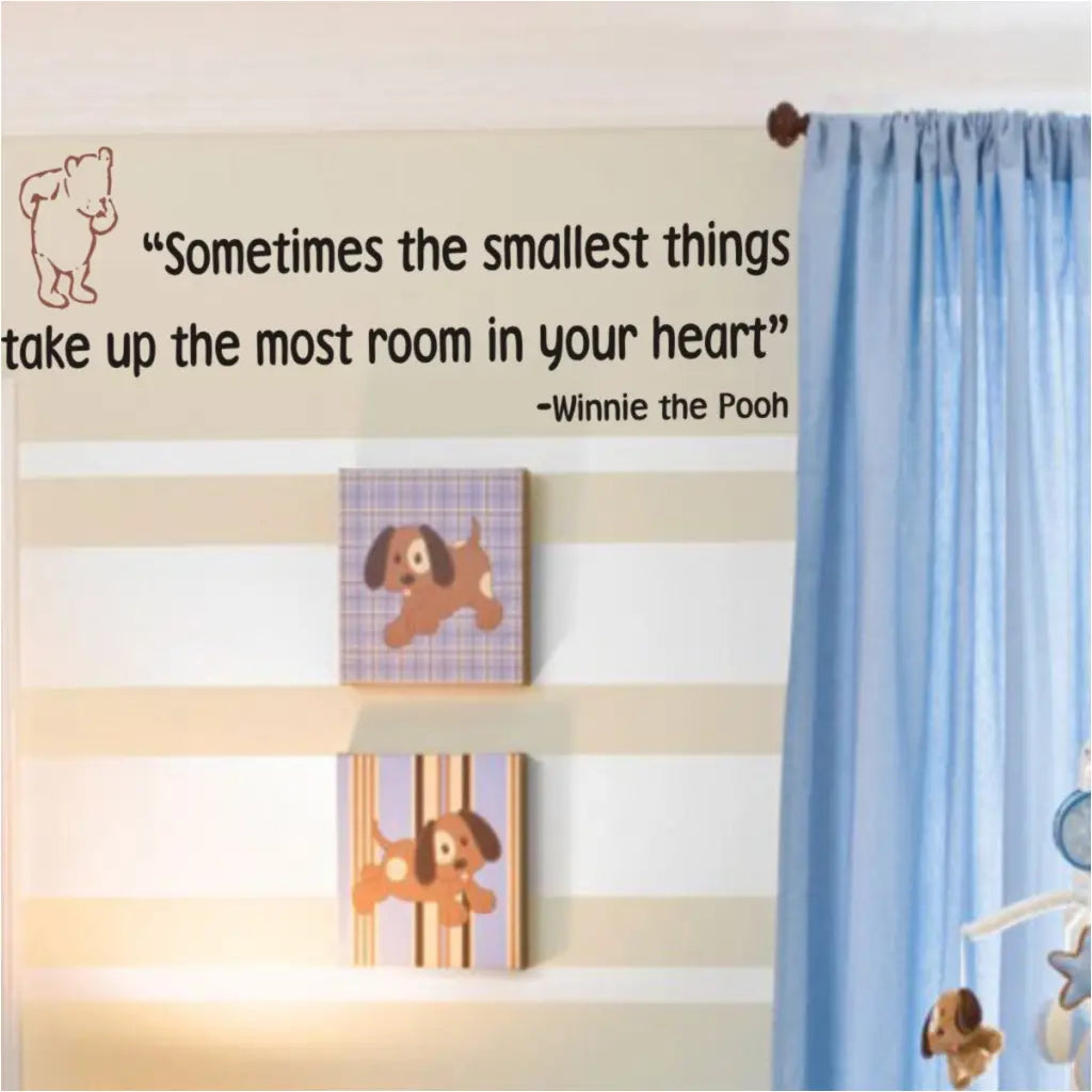 An adorable vinyl wall decal quote for baby's nursery that reads: Sometimes the smallest things take up the most room in your heart. Winnie the Pooh