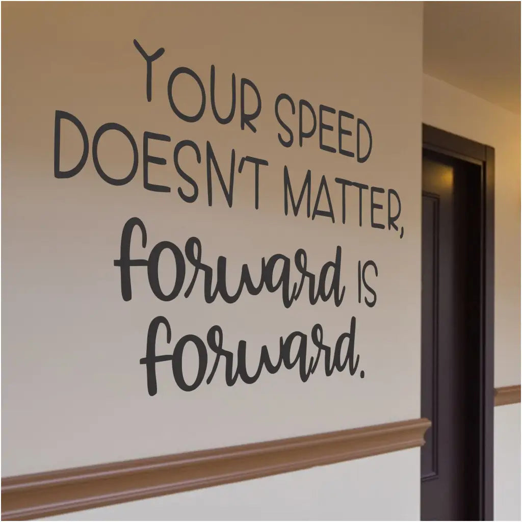 Motivational wall decal by The Simple Stencil that reads: Your speed doesn't matter, forward is forward.