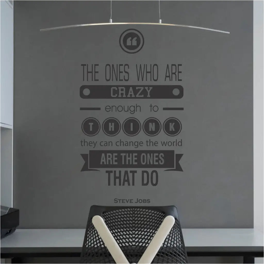Steve Jobs Crazy Enough To Change The World Quote as a wall quote decal placed over a home office desktop.