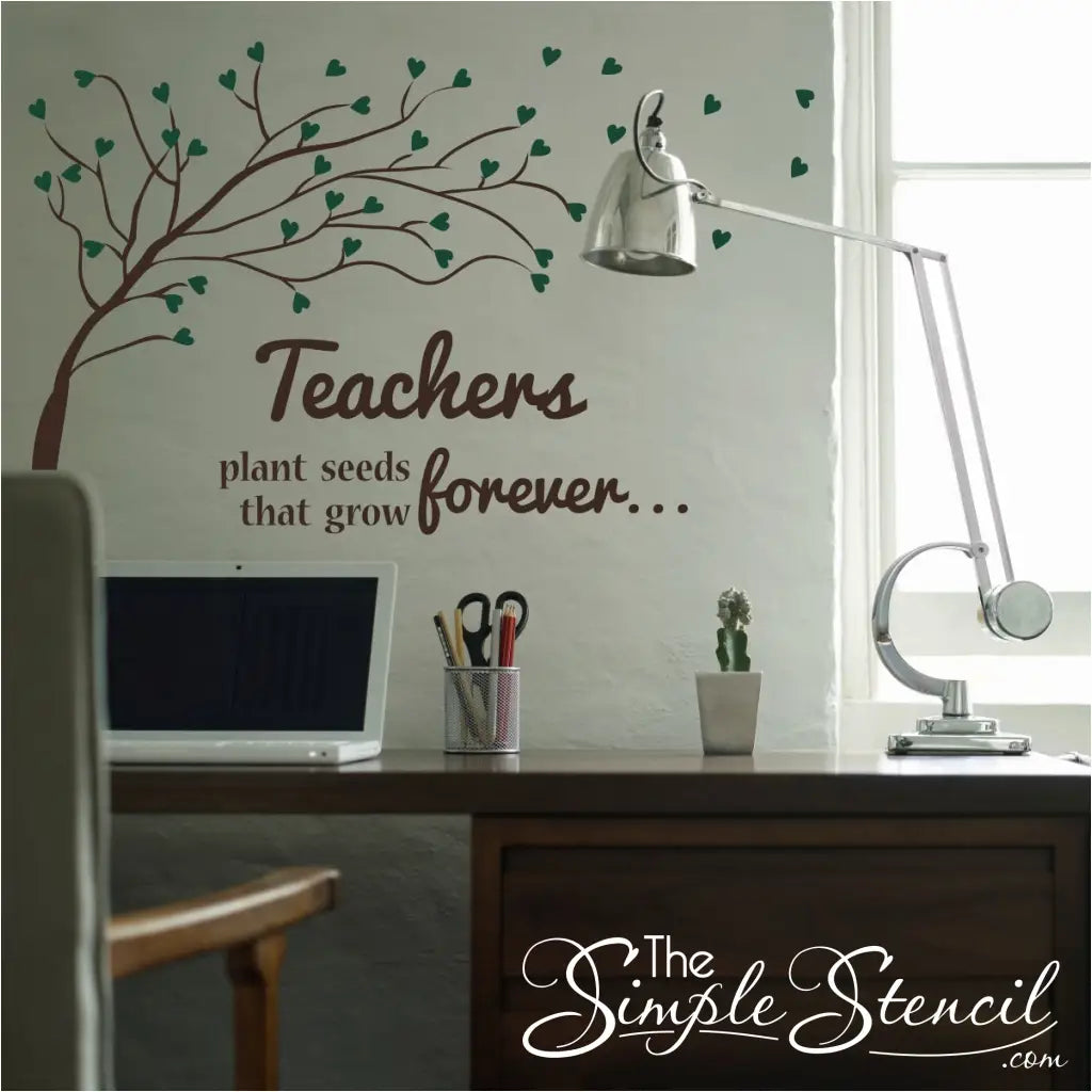 Tree decal with flowing heart leaves and a quote that reads: Teachers plant seeds that grow forever... in your choice of colors with leaves that can match your school colors or theme and makes a great gift for a teacher or Teacher's lounge display. This smaller size works great over a desk or in a smaller area of the classroom or office.