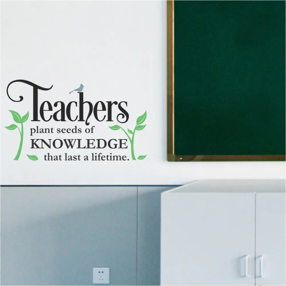 A colorful "Teachers Plant Seeds" inspirational wall decal displayed on a bright teacher's lounge wall with comfortable chairs. The plants, bird, and text are all in different colors to showcase customization options.